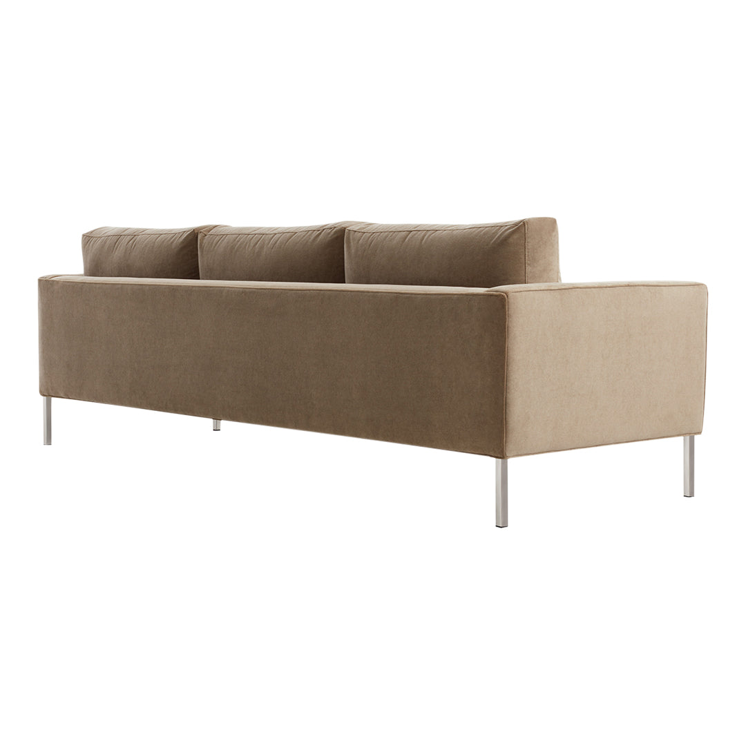 Tan, textured fabric sofa with three plush cushions and sleek metal legs. Modern minimalist design suitable for any decor.