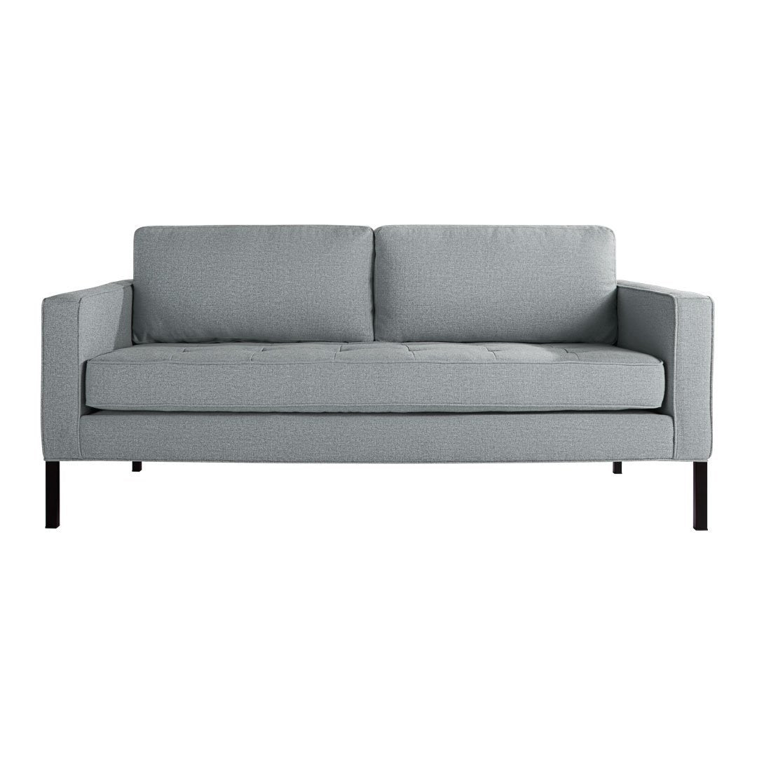 "Light gray modern sofa with clean lines and simple, solid fabric design."
