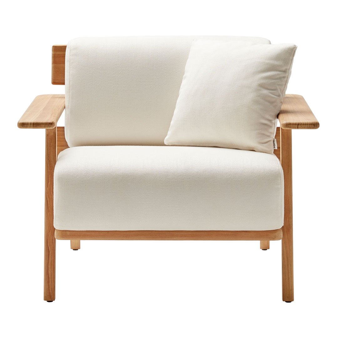 Modern white armchair with a soft cushion and natural wood accents, showcasing a minimalist design and neutral color palette.