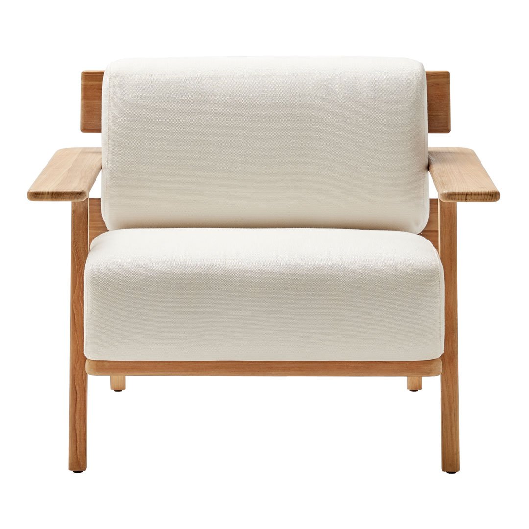 Cream-colored fabric armchair with natural wood accents, featuring a minimalist design and clean lines.