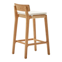 Natural wood bar stool with a light beige cushion and woven seat, perfect for a modern decor.