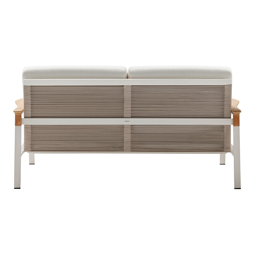 Modern two-seater sofa in neutral tones with white cushions and a natural wood accent. Clean lines and minimal design.