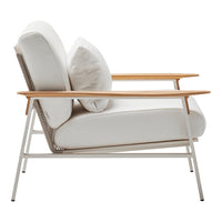 White armchair with soft cushions and natural wood accents, featuring a minimalist design and elegant lines.