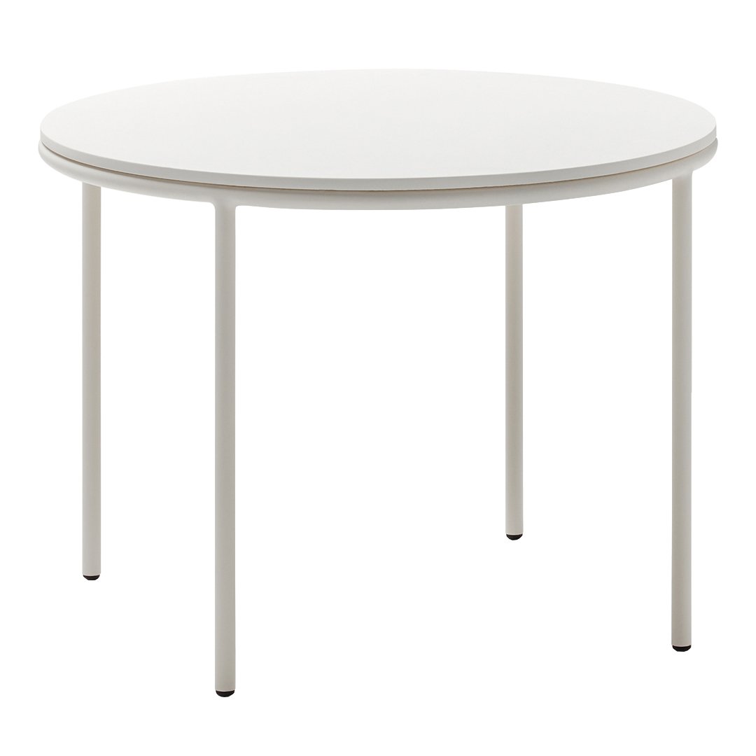 Round white table with a smooth surface and sleek metal legs, perfect for modern dining spaces.