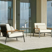 Modern outdoor chairs in cream and gray with wooden accents, featuring geometric patterned cushions.