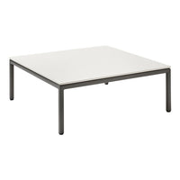 Square coffee table with a sleek white top and minimalist dark metal legs, featuring a clean, modern design.