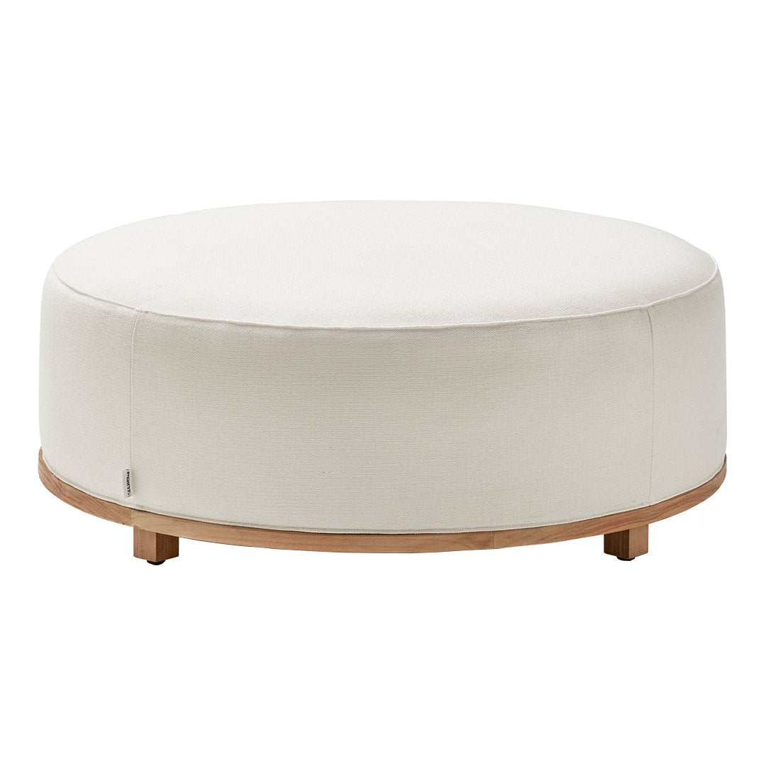 Round white ottoman with a smooth fabric top and natural wood base, perfect for modern decor.