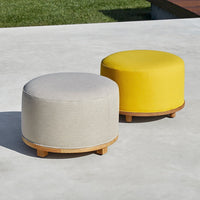 Stylish ottomans in grey and vibrant yellow with smooth fabric and round bamboo bases. Perfect for modern decor.