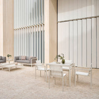 Modern outdoor furniture set in neutral tones, featuring white and gray colors with minimalist patterns. Elegant design.