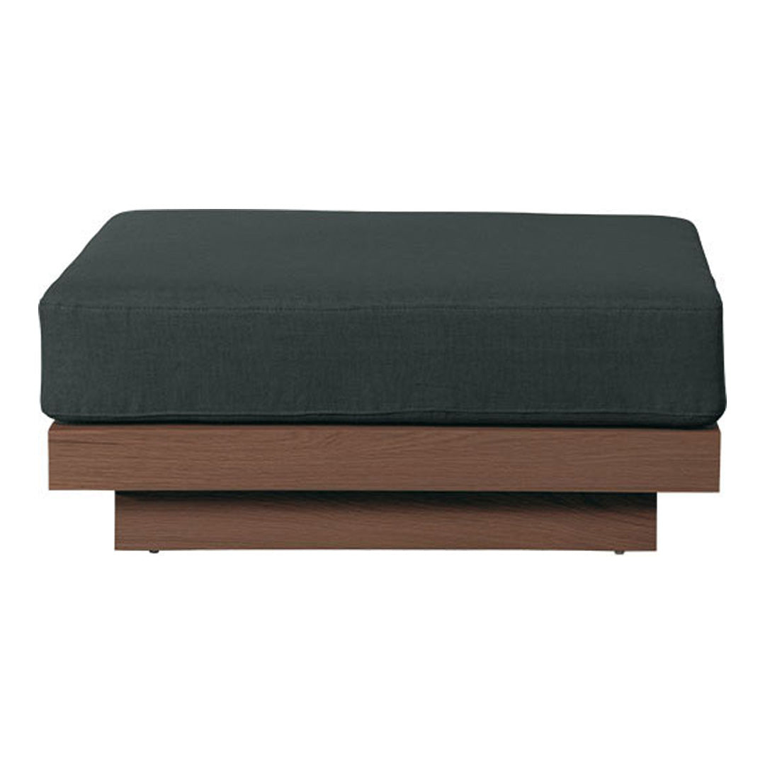 Dark gray upholstered ottoman with a smooth wooden base. Modern design with minimalistic style and clean lines.