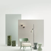 Stylish room featuring soft green, muted gray, and white tones, with sleek patterns in furniture and decor accents.