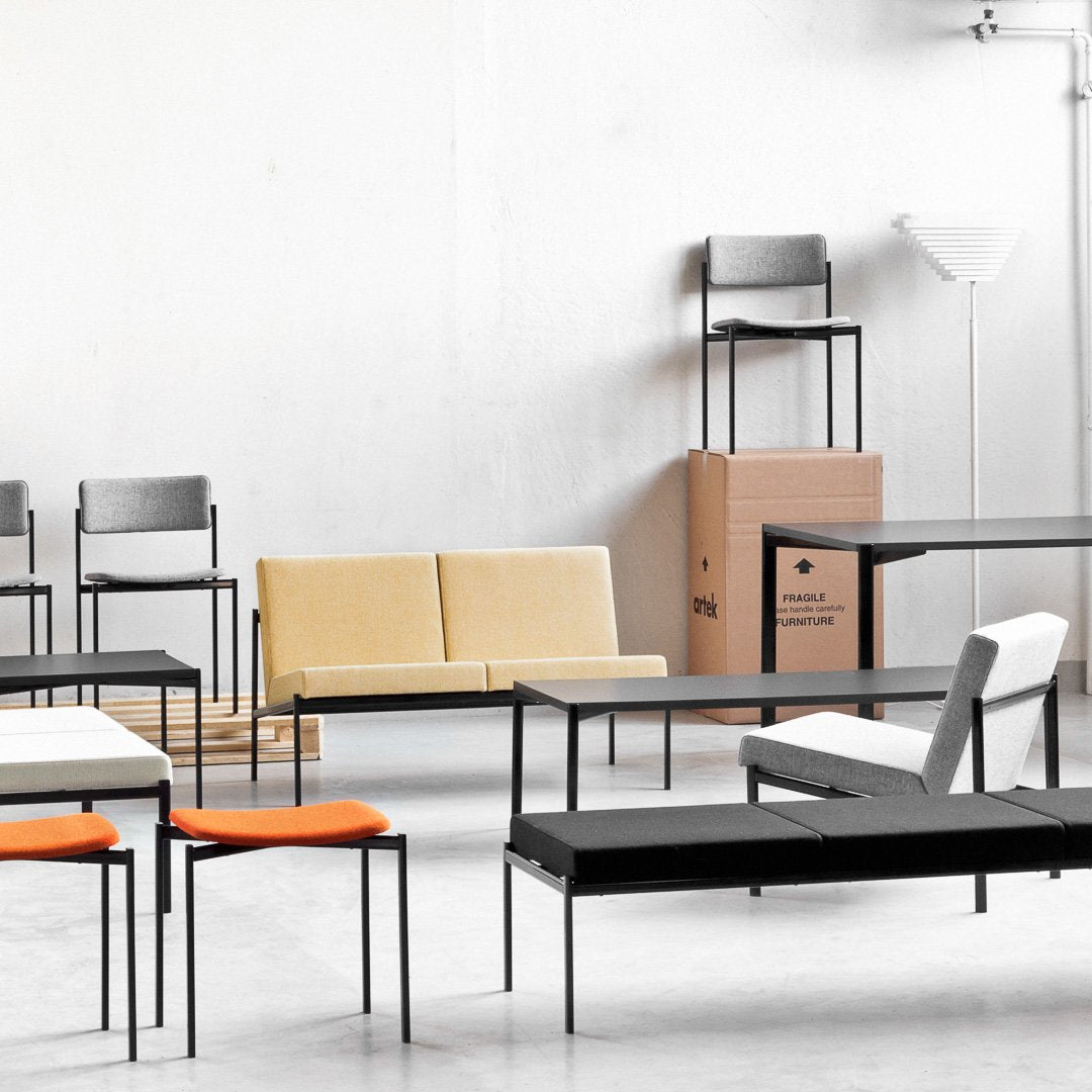 Modern furniture with a mix of gray, white, yellow, and orange, featuring sleek geometric patterns and clean lines.