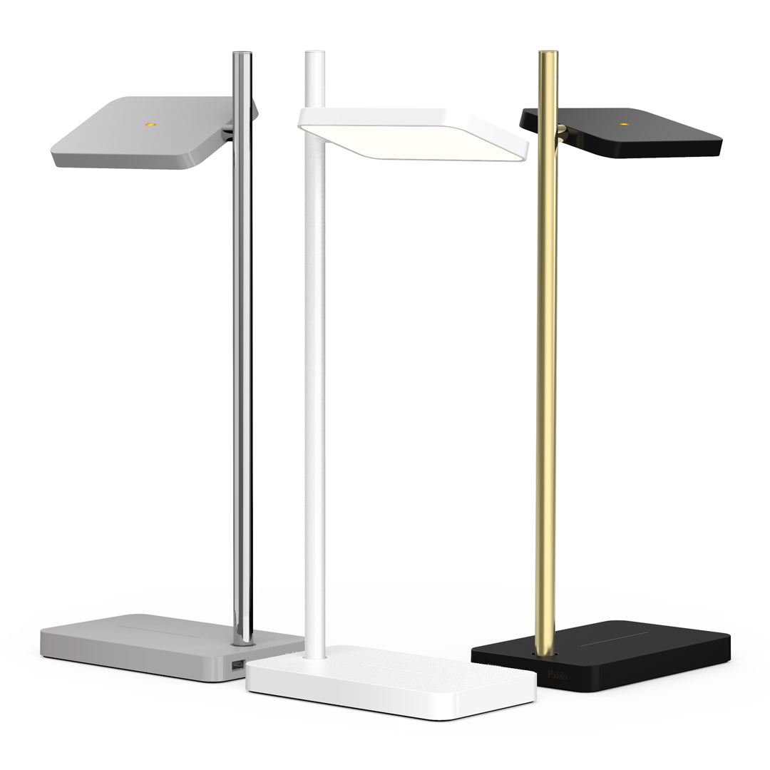 Modern LED desk lamps in sleek silver, matte white, elegant gold, and bold black with geometric designs.