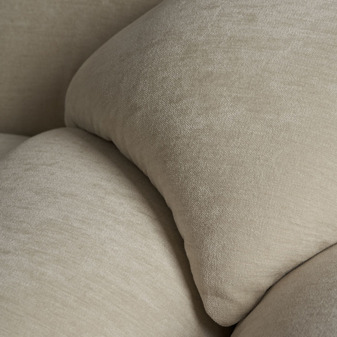 Light beige textured cushions with subtle pattern, adding warmth and softness to any living space.