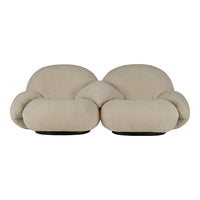 Beige plush loveseat with rounded shapes and soft texture, perfect for modern interior aesthetics.