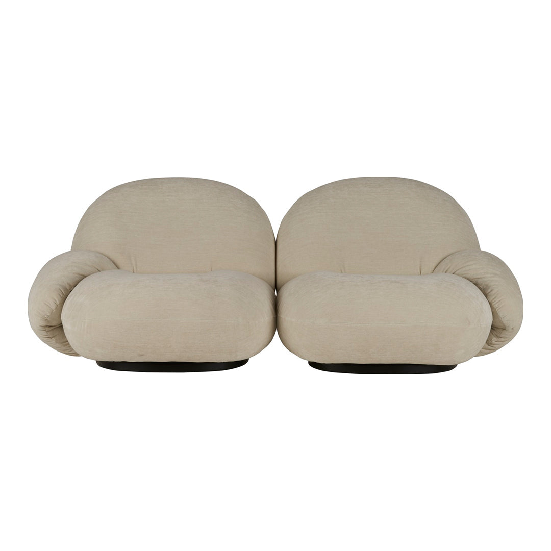 Beige upholstered loveseat with a smooth, plush texture and rounded, cozy shapes. Elegant and modern design.