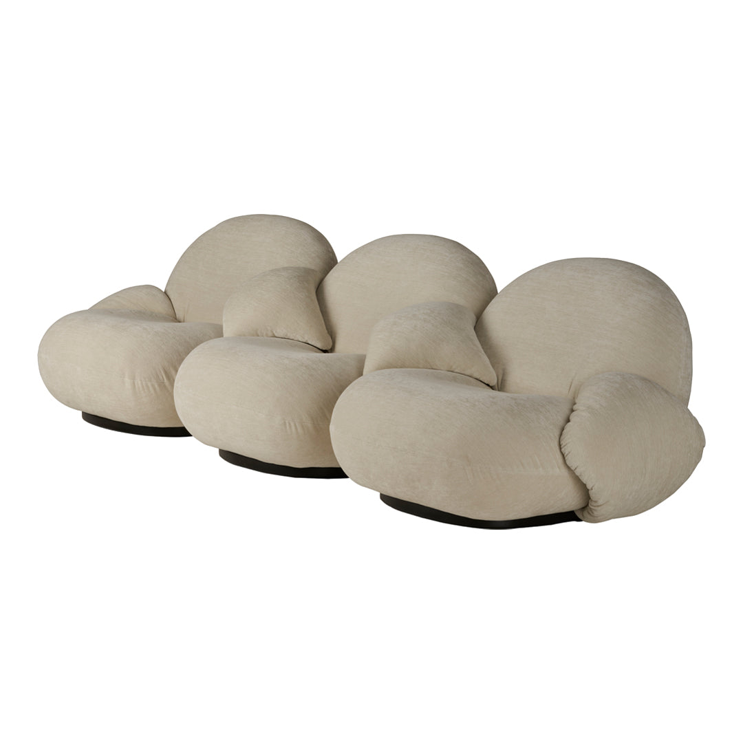 Beige plush three-seater sofa with organic shapes and soft, curved lines for a modern, cozy aesthetic.