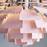 "Soft pink geometric panels with shiny chrome accents, creating a layered design for a modern aesthetic."