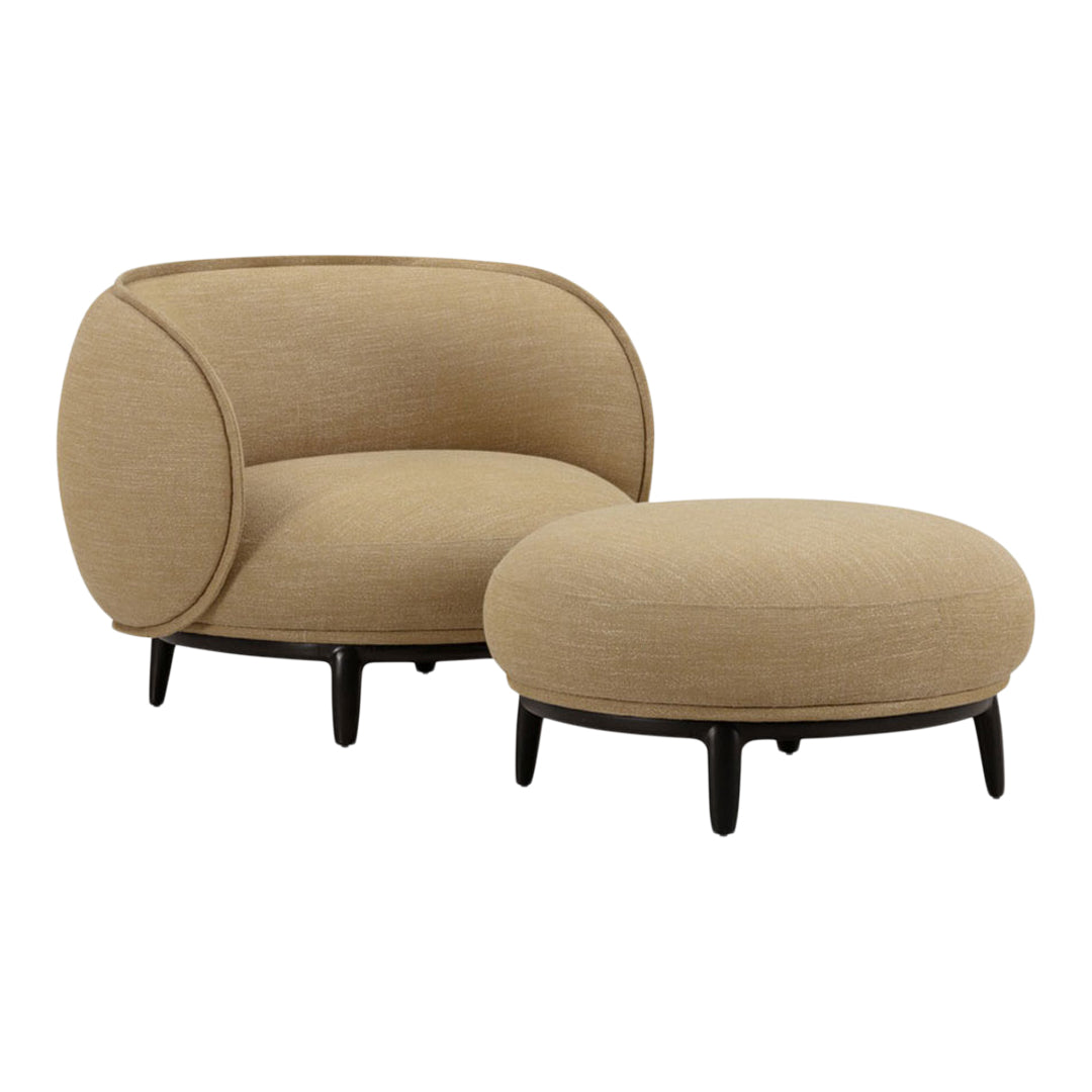 Beige curved armchair and matching round ottoman on black legs, featuring a smooth, minimalist design.