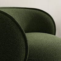 Olive green textured upholstery with smooth, rounded armrests. Modern, minimalist design.