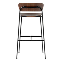 Wooden backrest with rich brown finish, sleek black metal legs, and minimalist design for modern decor.