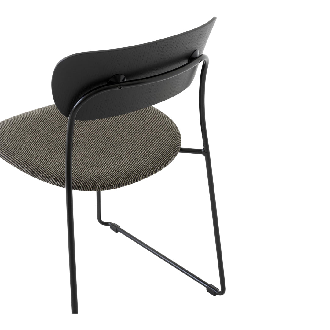 Black chair with a textured gray seat, showcasing a modern, minimalist design.