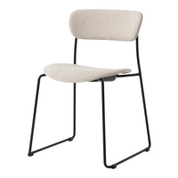 Beige upholstered chair with a smooth texture and minimalist black metal frame. Modern design for versatile styling.