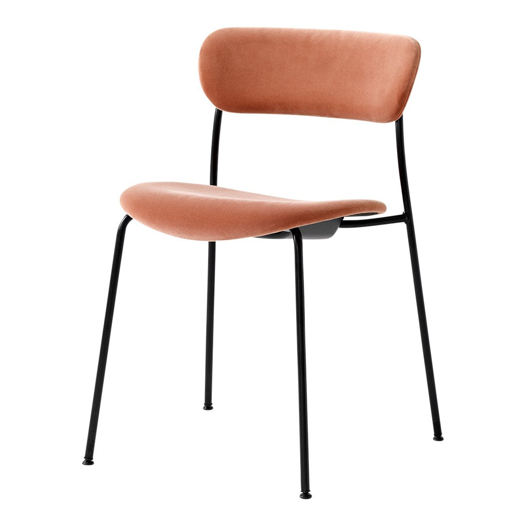 Rust-colored velvet chair with minimalist black metal legs, perfect for modern decor.