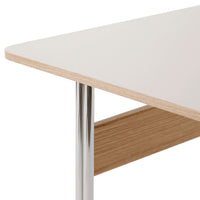 White tabletop with smooth finish, complemented by natural wood grain and chrome accents. Modern, minimalist design.