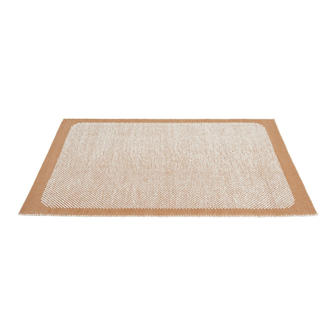 Beige and white textured rug with a geometric pattern and contrasting borders, adding warmth to any space.