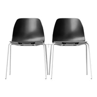 Black plastic dining chairs with white metal legs, featuring a sleek, modern design. Perfect for contemporary spaces.