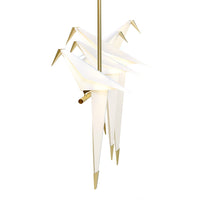 White origami cranes with gold accents, showcasing a sleek and modern design. Perfect for stylish home decor.