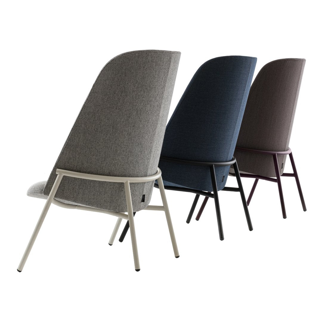 Three modern chairs featuring grey, navy, and dark brown upholstery with clean, minimalistic lines.