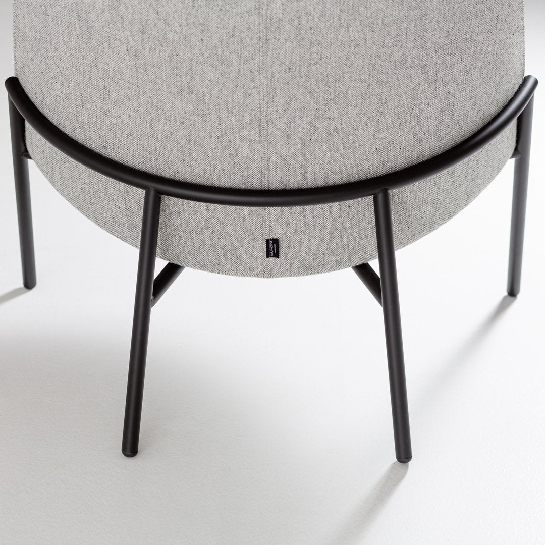 Gray fabric with a textured pattern, complemented by a sleek black metal frame. Ideal for modern decor.