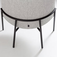 Gray fabric with a textured pattern, complemented by a sleek black metal frame. Ideal for modern decor.