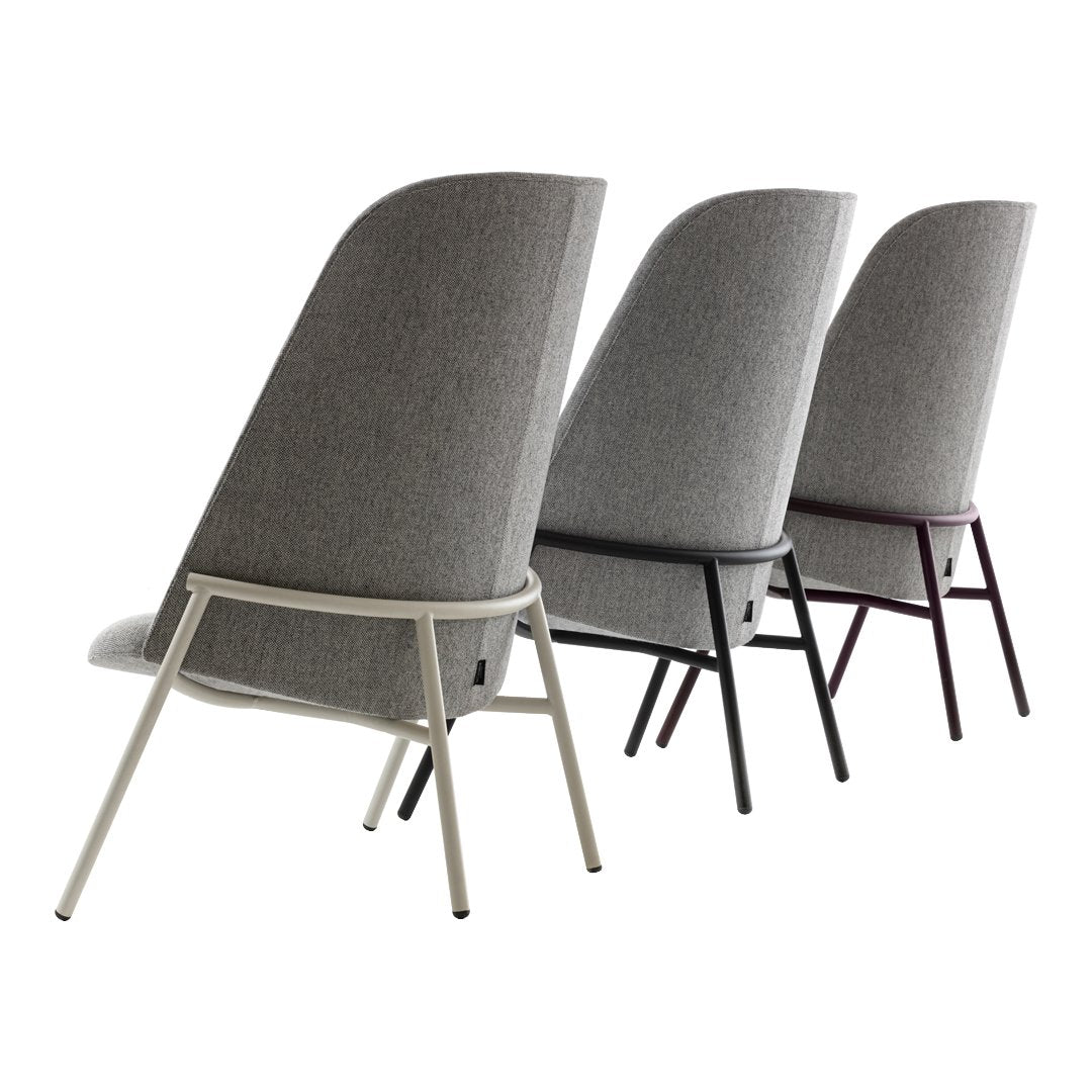 Three stylish chairs featuring a gray fabric and sleek metal frames in white, black, and burgundy. Modern design accents.