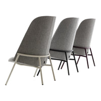 Three stylish chairs featuring a gray fabric and sleek metal frames in white, black, and burgundy. Modern design accents.