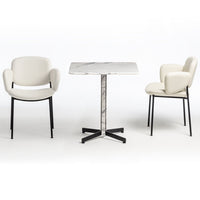 Elegant white leather chairs and a sleek marble-top table with black metal legs, perfect for modern dining spaces.