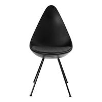 Black teardrop chair with a smooth finish and sleek metal legs, featuring a minimalist design. Ideal for modern decor.