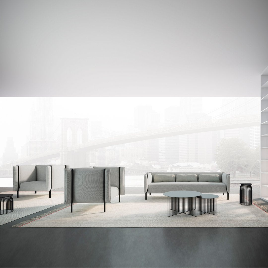 Sleek modern furniture in soft gray tones with subtle geometric patterns in a minimalist setting.