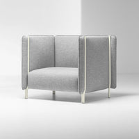 Modern gray armchair with textured fabric and sleek cream accents, featuring a minimalist design and clean lines.
