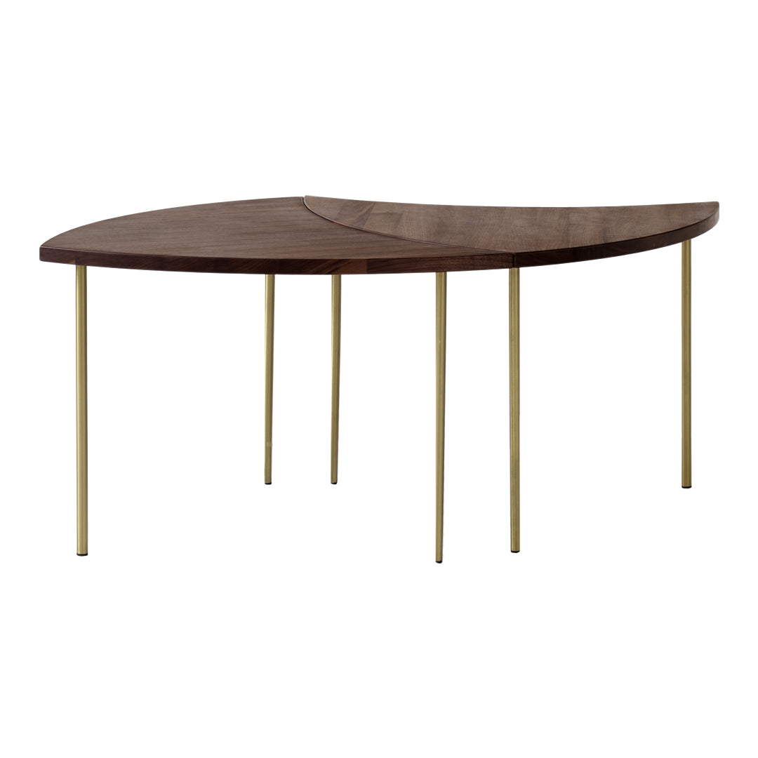 Wooden table with a rich brown finish and sleek gold metal legs, showcasing a modern, curvy design.