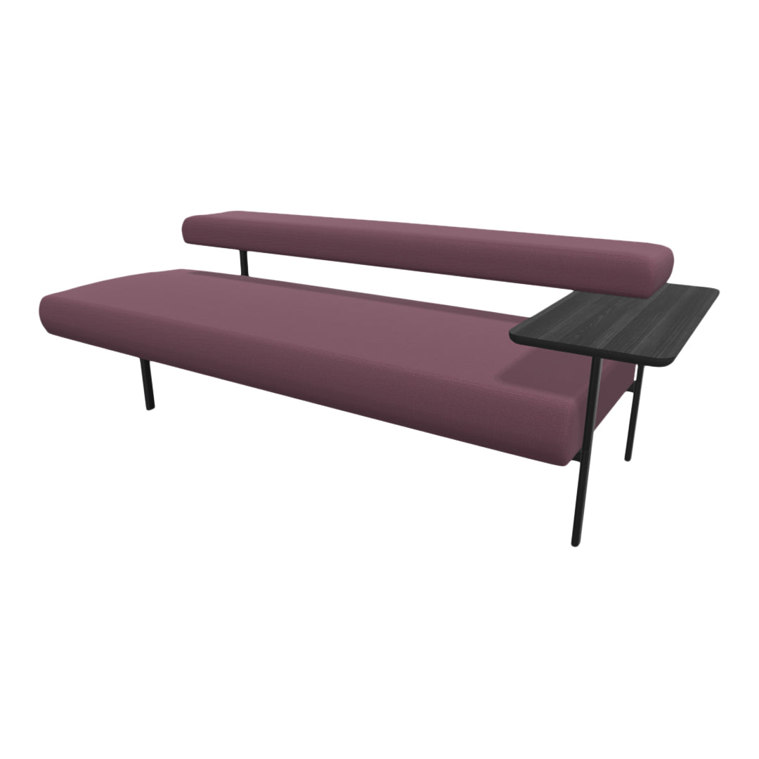 Modern sofa in rich burgundy with sleek black legs and a minimalist side table, featuring a textured fabric pattern.
