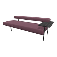 Modern sofa in rich burgundy with sleek black legs and a minimalist side table, featuring a textured fabric pattern.