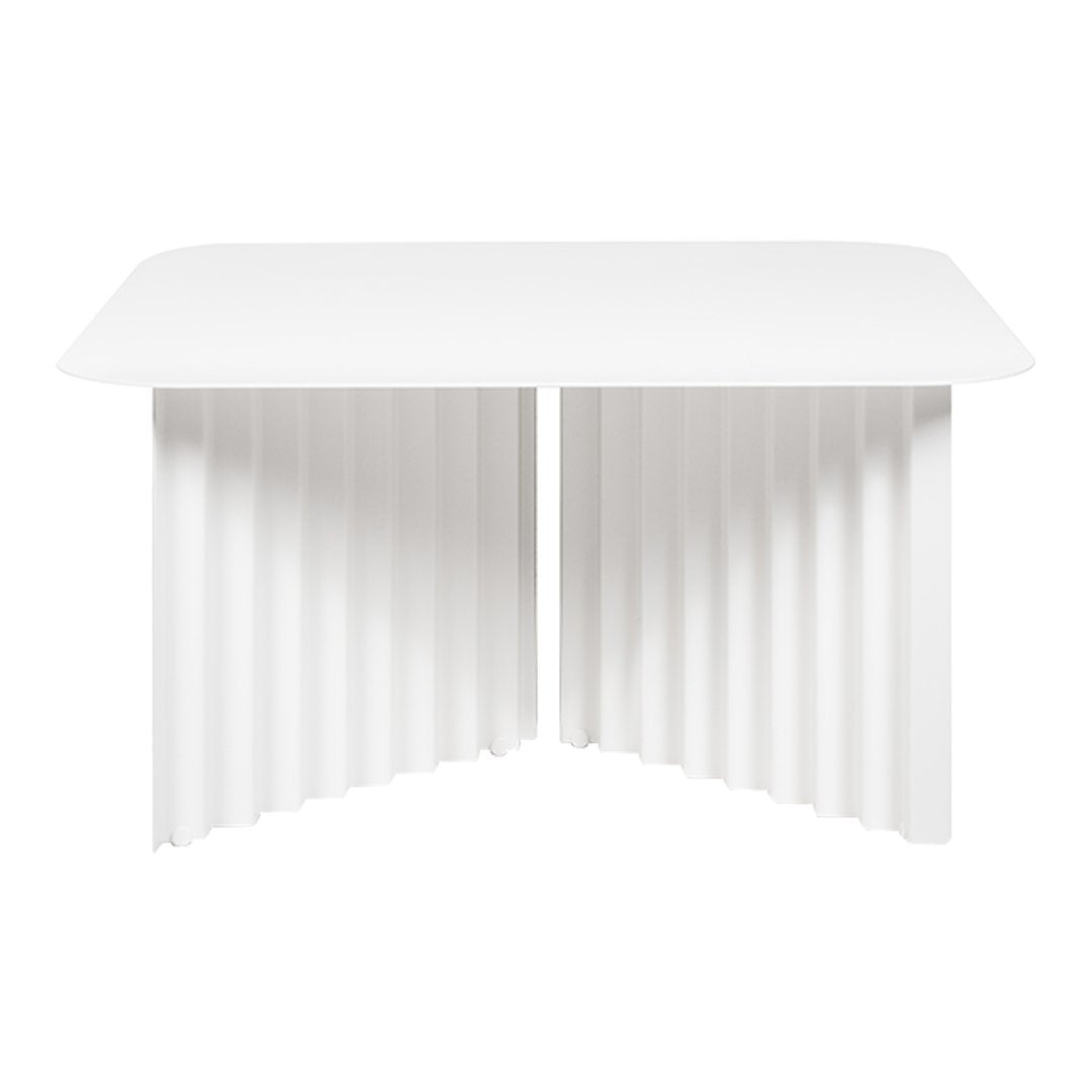 White modern table with a smooth top and fluted side pattern. Perfect for minimalist decor.