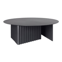 Sleek black round coffee table with a ribbed textured base, adding contemporary flair to any living space.