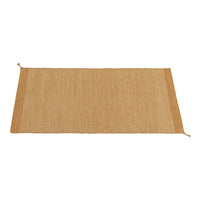 Natural beige area rug with a textured weave and subtle, neutral pattern. Ideal for rustic decor.