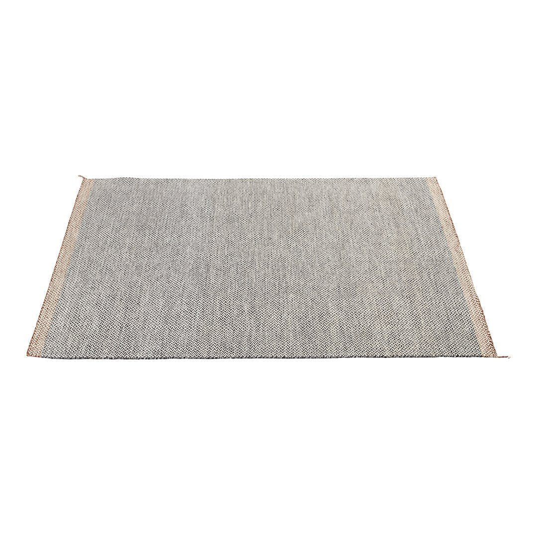 Gray woven rug with a textured design and natural fringe edges, perfect for modern interiors.