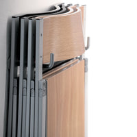 Stacked folding tables with a warm wood grain finish and sleek grey metal frames. Simple, modern design.