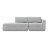 Light gray sectional sofa with a minimalist design and subtle textured fabric. Modern style perfect for any decor.